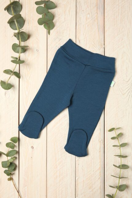 Blue newborn trousers with feet in merino wool